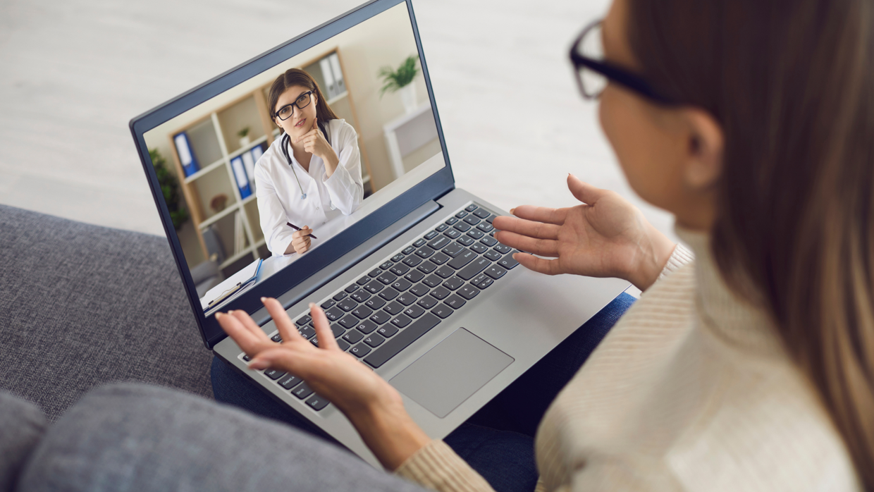 Doctor and patient speaking virtually